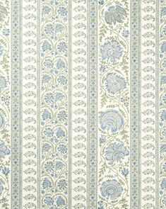 a blue and white striped wallpaper with floral designs on the outside, in an ornate pattern