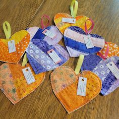 several heart shaped pieces with tags attached to them