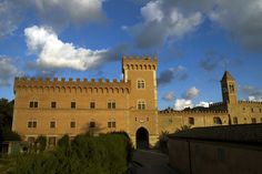 an old castle with a clock on the tower