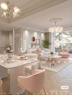 a living room filled with furniture and a chandelier hanging from the ceiling next to a dining table