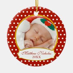 a christmas ornament with a baby's photo on it