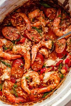 a large pot filled with cooked shrimp and vegetables