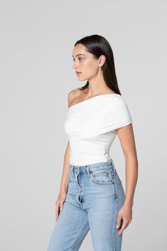 Elana is your new favorite off-the-shoulder top. Featuring ruching throughout the body and a crossover sleeve. She can be dressed up or down and is made with our signature fabric that hugs and smooths in all the right places. Made in LA Pre-washed Ruched Stretch Off-shoulder Top, Stretch Ruched Off-shoulder Top, Casual Stretch Ruched Off-shoulder Top, Casual Ruched One Shoulder Top, Spring Ruched Fitted Off-shoulder Top, One Shoulder Ruched Top For Spring, Stretch Off-shoulder Ruched Tops, Ruched Off-shoulder Fitted Top, Fitted Ruched Off-shoulder Top