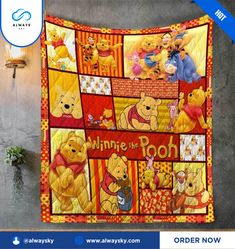 the winnie the pooh quilt is hanging up