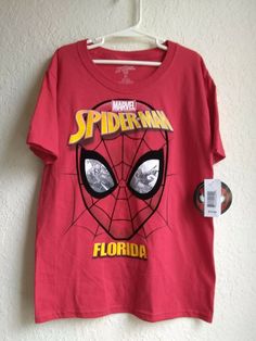 This is a brand New Marvel Spider-Man Florida Boys Red T-Shirt Size 6 / 7 Small. I have FAST & Free Shipping. Red Cotton Shirt With Screen Print, Red Crew Neck T-shirt With Character Print, Red Graphic Tee For Fan Merchandise, Red Short Sleeve Shirt For Fan Merchandise, Red Character Print Short Sleeve Tops, Red Short Sleeve Tops With Character Print, Red Fan Merchandise Shirt With Screen Print, Red Cotton T-shirt With Character Print, Spiderman Room Decor