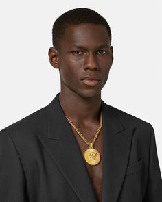 Medusa Biggie Necklace Gold | VERSACE US Formal Round Pendant Jewelry With Logo Charm, Luxury Medallion Jewelry With Logo Charm, Luxury Pendant Chain Necklace With Logo Charm, Luxury Large Medallion Necklace, Luxury Large Pendant Medallion Necklace, Luxury Large Round Pendant Medallion Necklace, Versace Jewelry, Versace Gold, Man Child