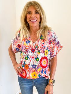 This beautiful embroidered top with a v-neckline and Dolman sleeves features a Mexican embroidery theme all over this top. So special and unique! Nonsheer, woven. Brand: Savanna Jane Multicolor Embroidered Button-up Top, Multicolor Embroidered Cotton V-neck Top, Multicolor Embroidered Tops With 3/4 Sleeve, Multicolor Bohemian V-neck Embroidered Top, Embroidery Theme, Bohemian Embroidered Cotton V-neck Top, Mexican Embroidery, Stunning Outfits, Embroidered Top