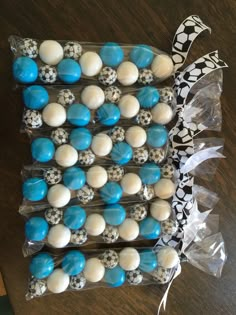 blue and white cake pops in plastic wrappers