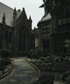 an old building with many windows and trees