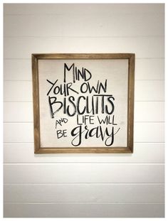 a sign that reads mind your own biscuits and life will be gray