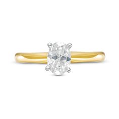 a yellow gold ring with an oval cut diamond on the top and bottom, set against a white background