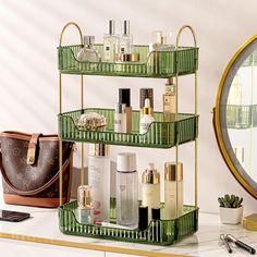 three tiered green metal shelf with cosmetics and other items on it next to a mirror