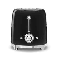 a black toaster sitting on top of a white table