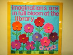 a bulletin board with flowers on it and the words,'congratulationss are in full bloom at the library '