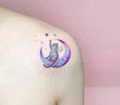 a cat sitting on the moon with stars around it's neck and back tattoo