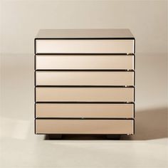 a white dresser with four drawers on it