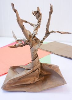 an origami tree made out of brown paper