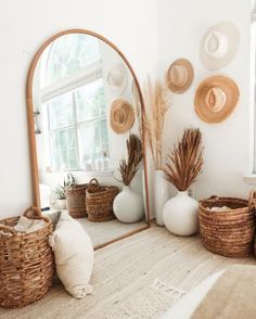 a mirror and some baskets in a room