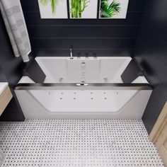 a white bath tub sitting inside of a bathroom