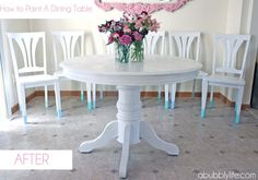 a white table with pink flowers in vases on it and the words how to paint a dining table