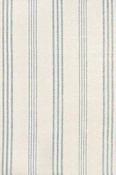 a blue and white striped wallpaper