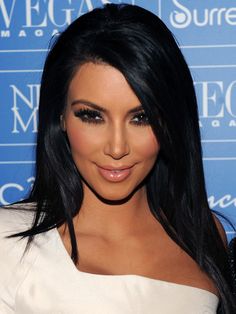 kim kardash is posing for the camera at an event in beverly, california