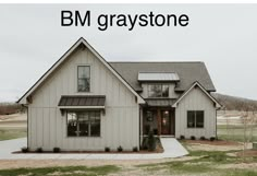 a white house with the words bm graystones on it