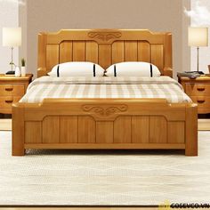 a wooden bed sitting in a bedroom on top of a hard wood floor next to two lamps