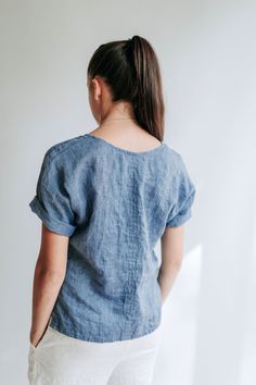 "Simple and comfortable linen top with above elbow length sleeves that can be rolled up or kept at above-elbow length. The top also features two short slits on the sides. An eco friendly and mindful choice for everyone seeking high quality materials and comfortable fit. In the images you see the top made from melange blue and white linens. Made from wonderfully textured and high quality medium weight European linen. Linen being highly absorbent fabric, the top will allow your body to breathe and Cheap Garment-dyed Relaxed Fit Tops, Cheap Linen Tops With Buttons, Cheap Linen Relaxed Fit Tops, Shirt With Sleeves, Linen Shirt Women, White Linens, Linen Top Women, Linen Shirts Women, Above Elbow