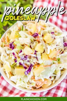 a white bowl filled with coleslaw salad on top of a red and white checkered table cloth