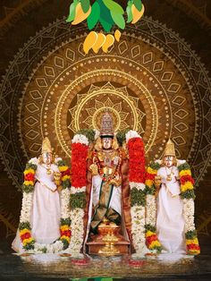 an idol is displayed in front of a backdrop