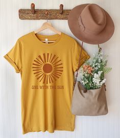 Stay One With The Sun with our oversized graphic printed on a unisex tee. SIZE UP for an oversized fit (see size chart!) Looking for more vintage/retro inspired tops and tees? Check these out: https://www.etsy.com/shop/TheGraphicPeach?ref=seller-platform-mcnav&section_id=33890848 Our shop uses direct-to-garment printing to make our products. The design ink is sprayed on, then allowed to soak into the fibers of the garment. This process yields fine quality prints and a smooth finish on the ga Pre-shrunk Yellow Shirt For Spring, Spring Yellow Pre-shrunk Shirt, Vacation Cotton Shirt Pre-shrunk, Yellow Crew Neck Summer Shirt, Yellow Cotton Shirt For Summer, Summer Yellow Cotton Shirt, Yellow Cotton Summer Shirt, Yellow Cotton Shirt For Beach Season, Happy Glamper