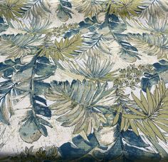 an upholstered fabric with leaves and flowers on it