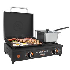 an electric griddle grill with the lid open and food cooking on it's side