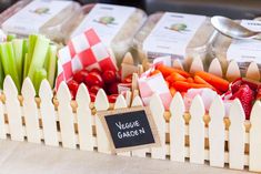 vegetables and spices are in baskets on display at a farmers'market, with a sign that says vegetable garden