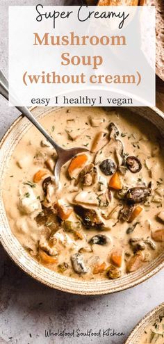 a bowl of mushroom soup with cream in it on a table next to sliced bread