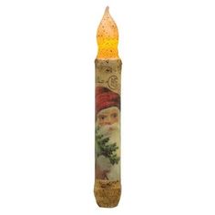 a lighted candle with a santa clause on the front and side, decorated with gold flakes