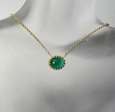 Cabochon Cut Oval Shape Natural Green Emerald  The gemstone weighs 3.20 carat and measures 10.5x9x5mm  It is set in a 14 karat yellow gold ornamental center frame of a necklace.  The rolo design chain weighs 1.4 grams and it is 10 karat yellow gold with a spring ring clasp. Luxury Yellow Gold Oval Cabochon Gemstones, Fine Jewelry Yellow Gold Cabochons For Formal Occasions, Oval Yellow Gold Cabochons For Formal Events, Formal Yellow Gold Cabochons With Bezel Setting, Elegant Green Gemstone Cabochons, Formal Round Cabochon Necklaces, Classic Gold Gemstone Cabochons, Luxury Gold Gemstone Cabochons, Gold Elegant Cabochons With Bezel Setting