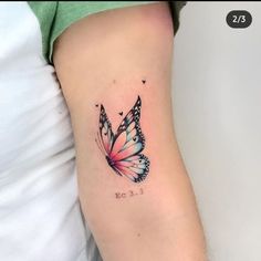 a small butterfly tattoo on the arm