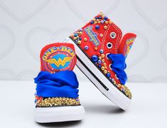 How adorable are these Wonder woman inspired converse! The perfect shoe to complete the look! Please leave your name needed in the notebox during checkout Visit the tutu section or search bar for the matching outfit! If you are unsure of sizing please scroll to the last photos for our size charts, or visit our size charts here--> https://pinktoesnhairbows.com/pages/size-chart All sales are FINAL, Ship dates can be found directly on the listing, please view our policies in detail here---> https:/ Wonder Woman Shoes, Overalls Boys, Tutu Dress Costumes, Bling Converse, Girls Overalls, Girls Converse, Matching Outfit, Birthday Tutu, Search Bar