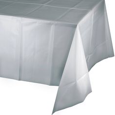 a white table cloth on top of a wooden table