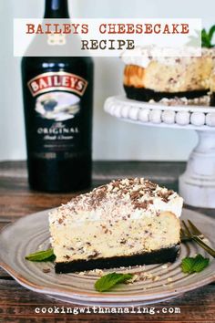 a slice of bailey's cheesecake on a plate with a bottle of beer in the background