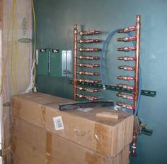 an electrical box with many wires on top of it in a room that is being remodeled