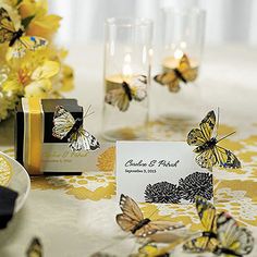 a table topped with lots of yellow butterflies