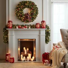 a living room decorated for christmas with candles and presents