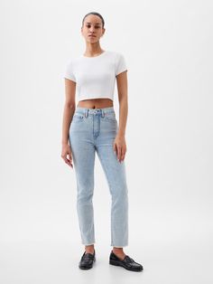 Fit: A slim, ankle-length classic.  More room than our True Skinny, but just as comfortable.  Fabric: 87% Cotton, 7% Recycled Materials, 5% Polyester, 1% Stretch.  Stretch: Stretch Jeans.  A bit of hug & a lot of hold.  Comfortable & designed to flatter.  Rise: High Rise Jeans.  Look: A classic five-pocket jean in a light indigo wash Details: Zip fly, five-pocket styling, holds-you-in front pockets, & raw hem.  Responsibly Made: This pair of jeans is part of our water-saving Washwell program.  C Gap Classic Mid-rise Bottoms, Classic Mid-rise Gap Bottoms, Classic Mid-rise Bottoms By Gap, Fitted Cropped Leg Pants For Everyday, Classic Gap Pants For Spring, Gap Mid-rise Bottoms For Everyday, Classic Gap Bottoms With Five Pockets, Chic Straight Leg Gap Jeans, Gap Straight Leg Everyday Bottoms