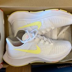 White Nike Womens Air Zoom Pegasus 37 Running Shoes. White/Lt Zitron/Bright Mango. New In Box. Size 11. Nike Yellow Running Shoes For Marathon, Indoor Cycling Shoes, Pink Tennis Shoes, Nike Free Flyknit, Nike High Tops, Nike Waffle, Nike Tanjun, White Running Shoes, Nike Pegasus