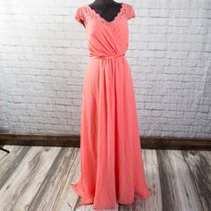 Long, Coral Formal Or Bridesmaid Dress. Worn Once For A Wedding. No Major Alterations Have Been Made. The Front Hem Was Tapered About 1-2 Inches To Accommodate My Height (5'4). The Hem Needs To Be Re-Sewn (See Photos.) Which Will Have To Be Done Anyway If You Need To Shorten It More. Features Lace Short Sleeves And Keyhole Back With A Tie At The Top. No Apparent Damages Have Been Found - Item Is Like New! Please Review Photos And Ask Any Questions. Christina Wu, Bridesmaid Dress Sizes, Lace Short, Size 16 Dresses, Bridesmaid Dress, Lace Shorts, Pink And Orange, A Wedding, Size 16