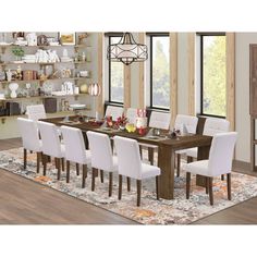 a dining room table with white chairs in front of a book shelf filled with books