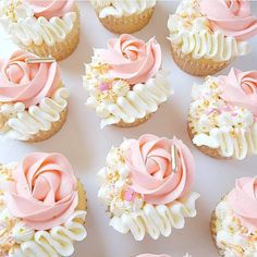 cupcakes decorated with pink frosting and flowers